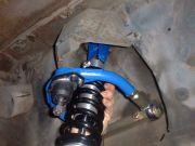 Mount upper end of coilover shock